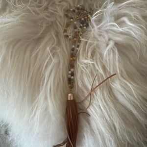 Beaded necklace with tassel apprx 18” with 3 “ tassel
Gold,blues, green, white